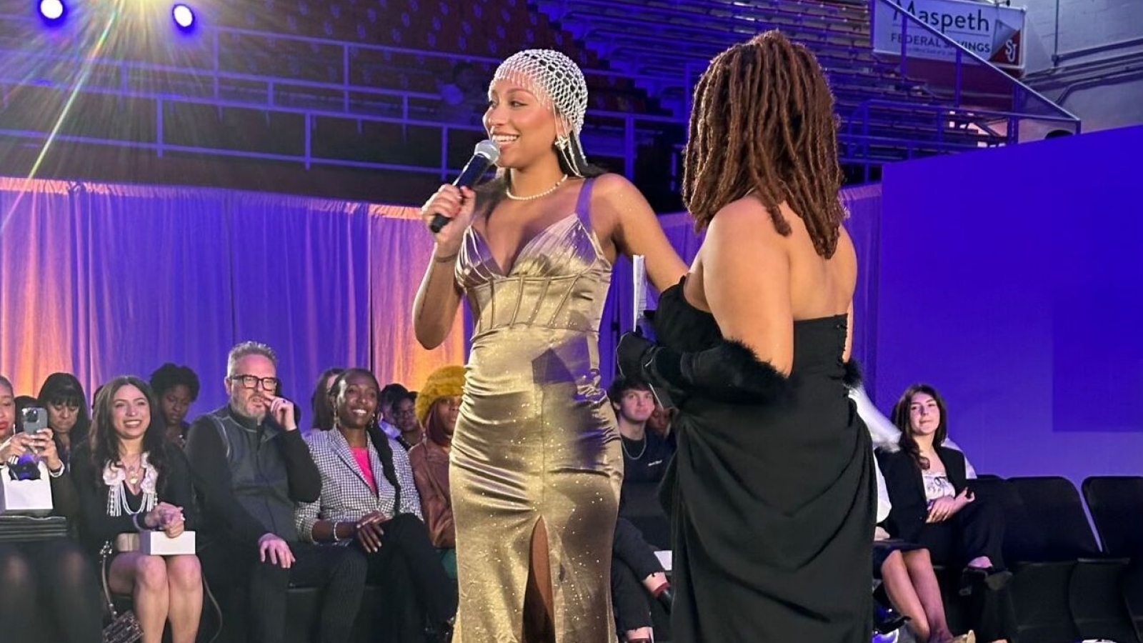 St. John's student, Madison Coombs, leading the annual Red House Club Fashion Show 