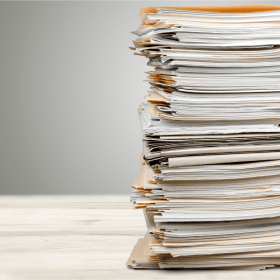 Stack of several Letters of Recommendation in an application pool, emphasizing the role of strong endorsements in standing out among candidates.